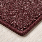 Esmera Teppich nach Maß | Farbe: Bordeaux (025) | gekettelte Kante (Beispielbild, Farbe kann abweichen)