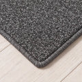 Kontura Teppich nach Maß | Farbe: Grau Dunkel | gekettelte Kante (Beispielbild, Farbe kann abweichen)