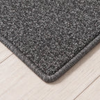 Kontura Teppich nach Maß | Farbe: Grau Dunkel | gekettelte Kante (Beispielbild, Farbe kann abweichen)